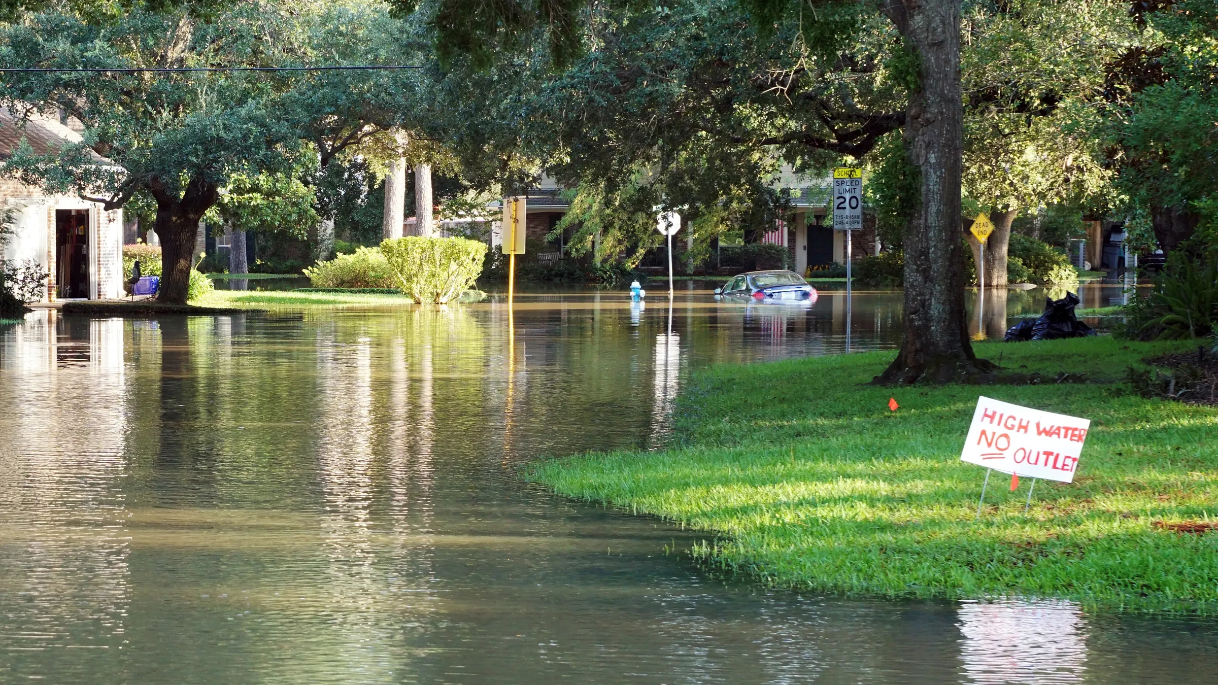 A High Water road sign standing in floodwater on a Texas street